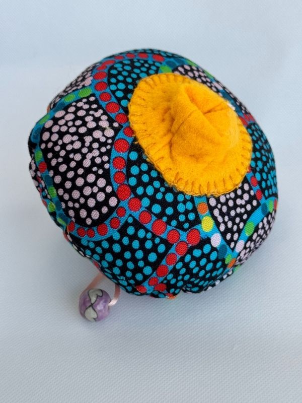 Blue cloth Aboriginal design pull cord breast model front on view