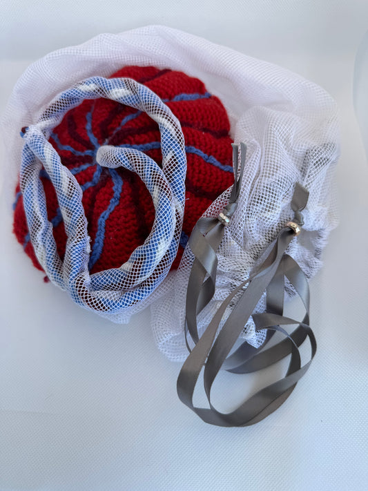 Red and blue knitted flower with ribbons Childbirth Education Model