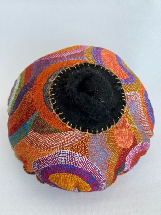 Orange cloth Aboriginal design breast model close up nipple